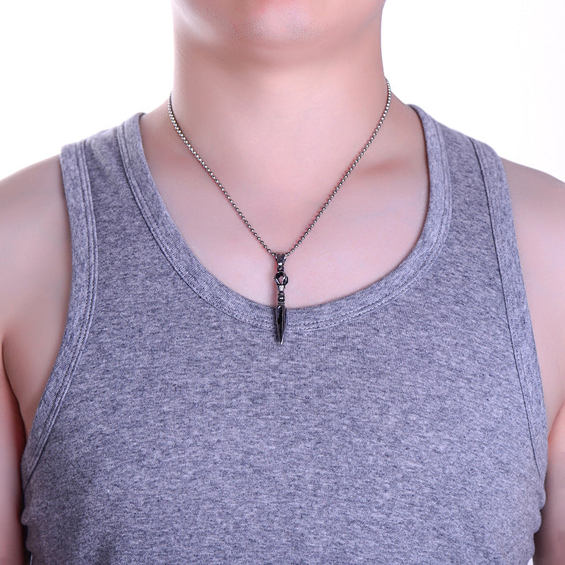 Collier avec pendentif en acier inoxydable représentant un instrument du Dharma