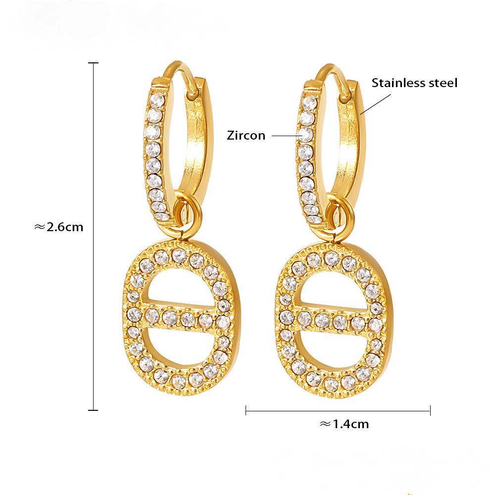 Boucles d'oreilles pendantes creuses en acier inoxydable avec zircone cubique