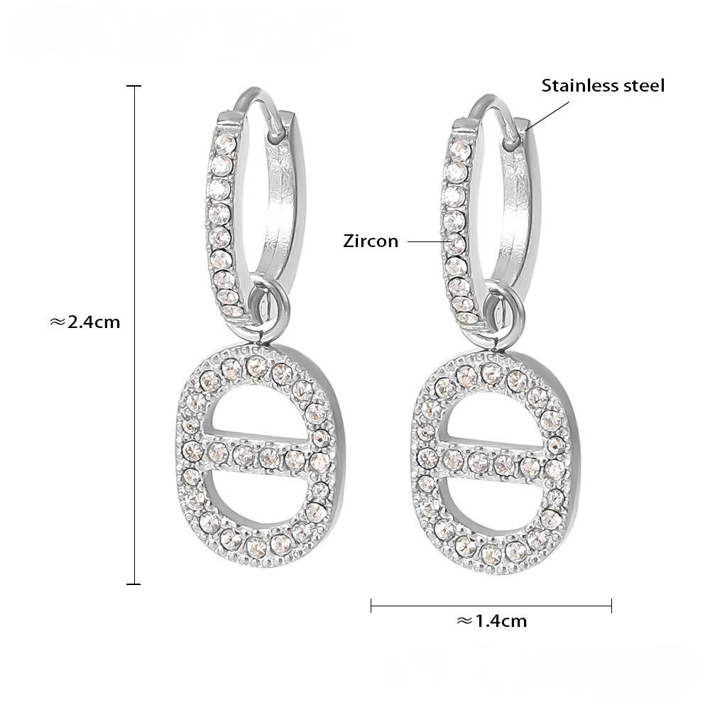 Boucles d'oreilles pendantes creuses en acier inoxydable avec zircone cubique